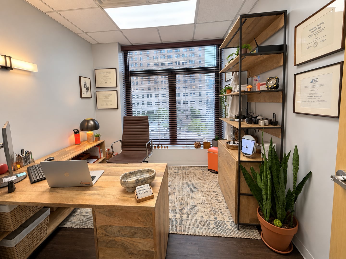 Pinnacle Audiology office with wood furnishings, plants and framed certificates